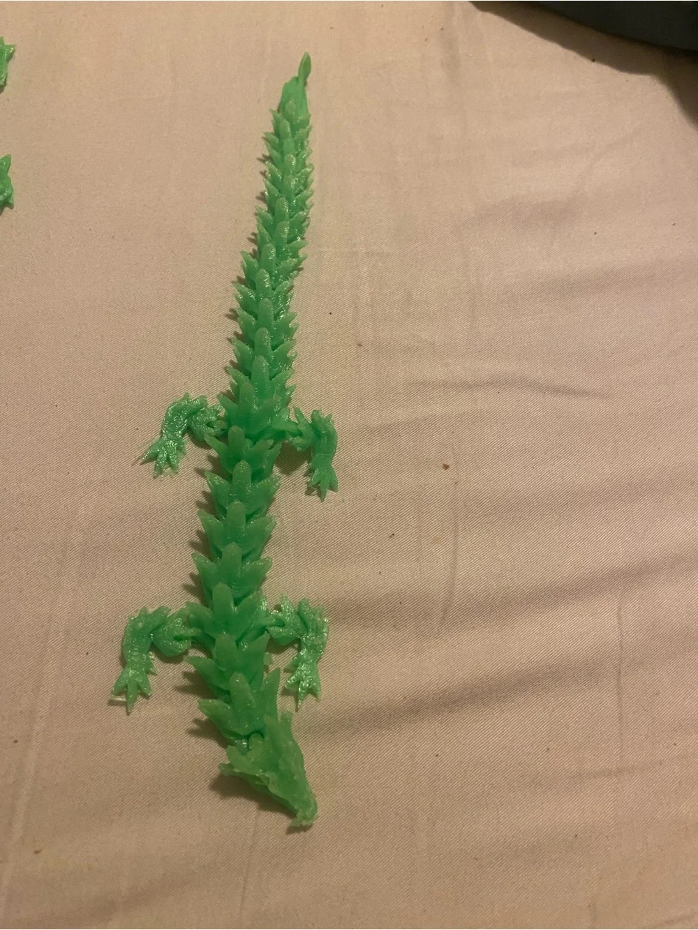 3-D green printed articulated dragon
